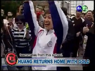 Huang Returns Home with Gold