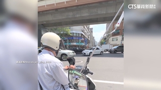 險！　騎士「邊吊點滴邊騎車」　竟只是為了「買飲料」